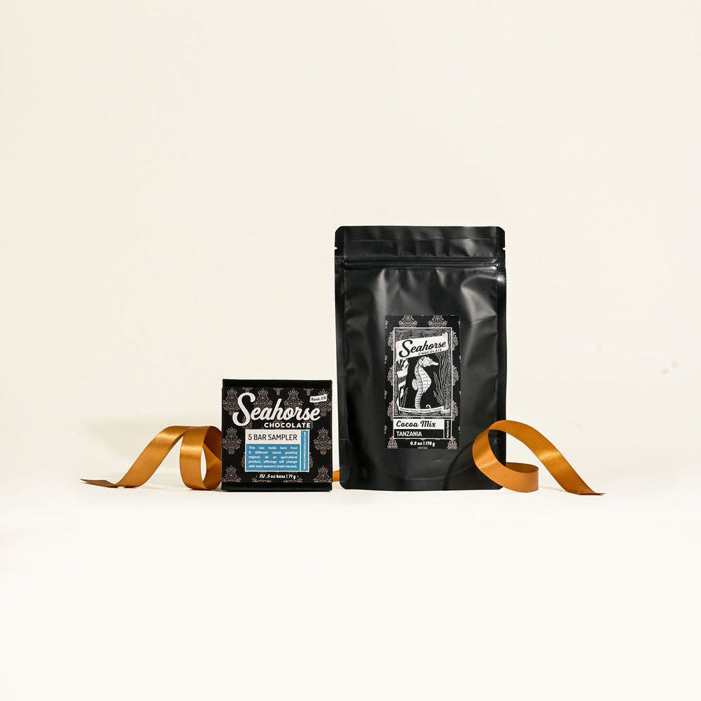 Black cocoa mix bag and chocolate bar sampler with 'Seahorse' branding on a white background