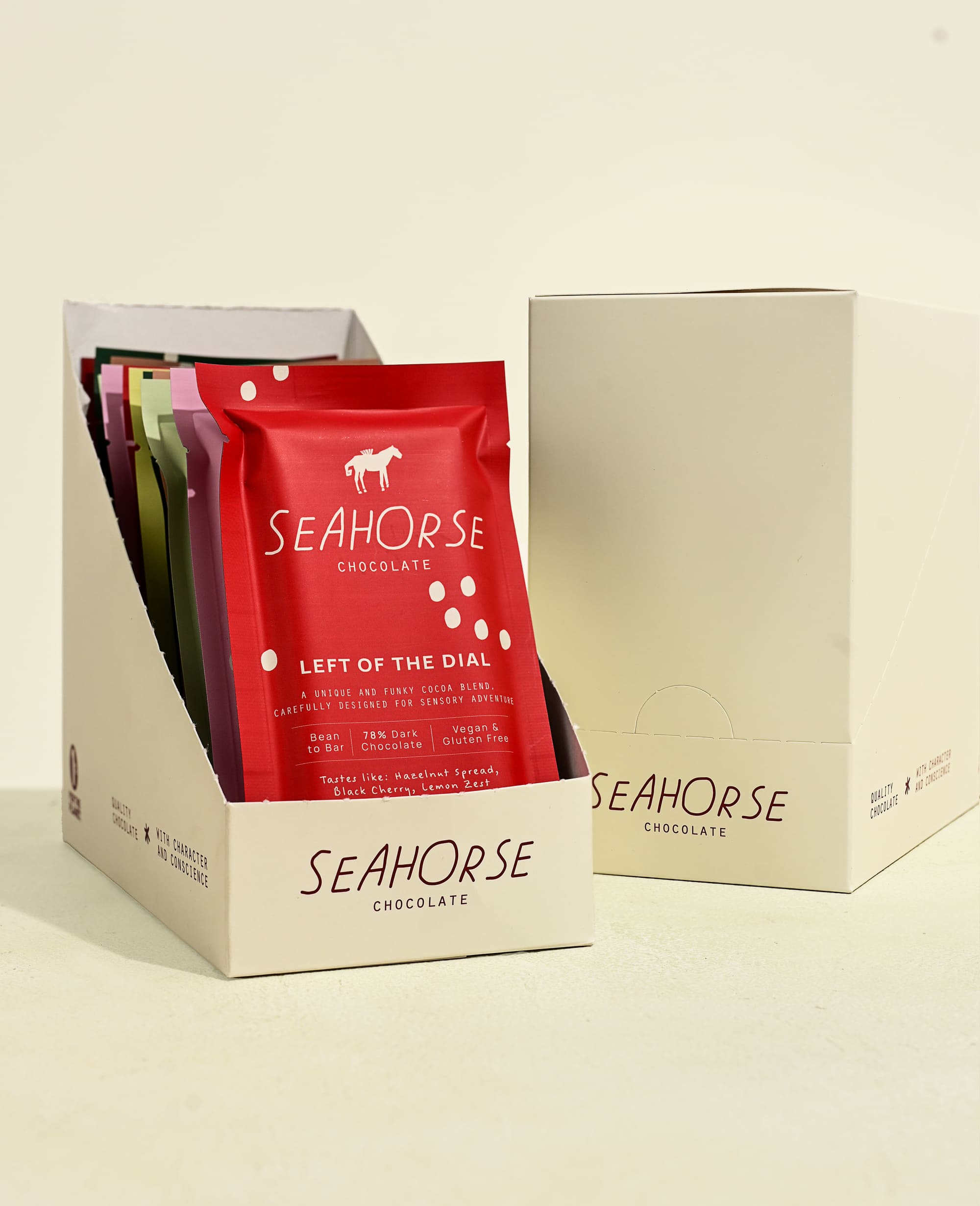 Seahorse Chocolate bars in a cardboard display box on a beige background