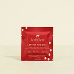 Red packaging of Seahorse Chocolate bar on a beige background