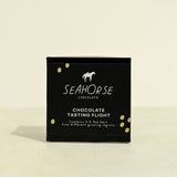 Seahorse Chocolate tasting flight chocolate sampler on a beige background