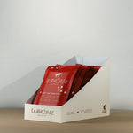 Red Seahorse chocolate bars in a white display box on a neutral background