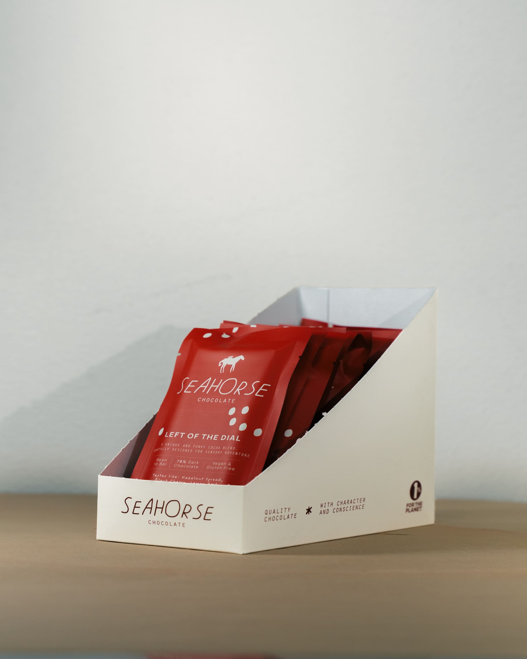 Red Seahorse chocolate bars in a white display box on a neutral background