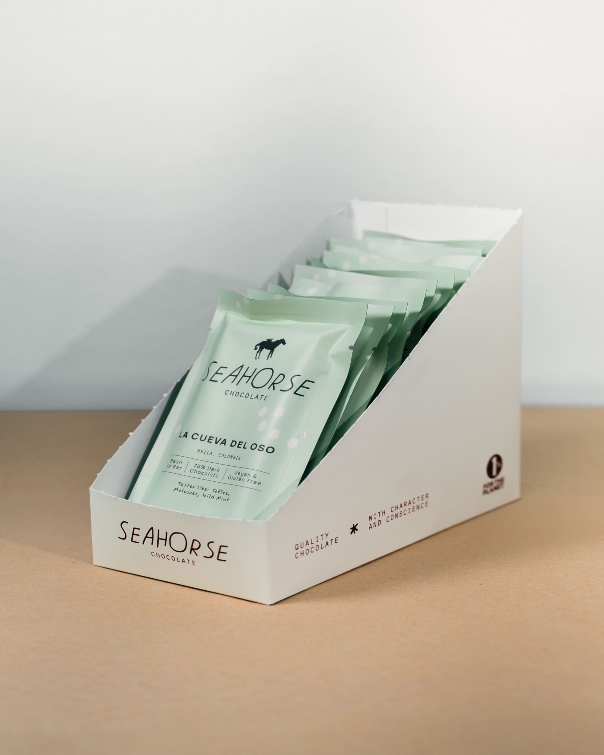 Box of Seahorse chocolate bars on a beige surface with a white background
